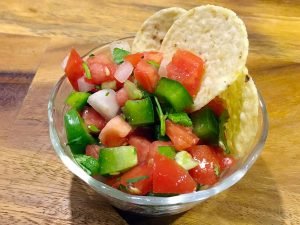 Pico De Gallo is a fresh mexican salsa. Spicy, fruity, and so easy to make, this recipe goes great with tortilla chips, quesadillas, or nachos. You can even put it on your tacos! | Tiny Kitchen Cuisine | http://tiny.kitchen
