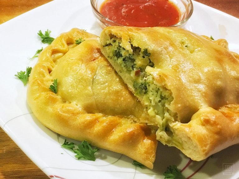 Cooking this Spinach Artichoke Calzone recipe from scratch in a tiny kitchen can be a labor of love but knowing how to make calzones is definitely worth it! | Tiny Kitchen Cuisine | http://tiny.kitchen